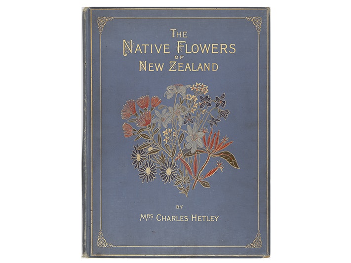 The native flowers of New Zealand, 1888, London, by Mrs Georgina Hetley, Sampson Low, Marston, Searle and Rivington Ltd., Leighton Brothers. Te Papa (RB001454) A book cover from 1888 with the title in gold print and a botanical illustration in the middle. The rest of the cover is blue.