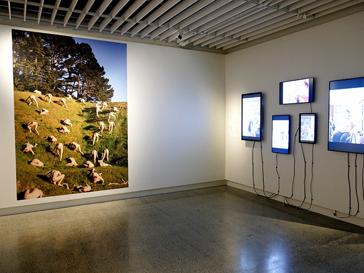 Sage Rossie-Tong, My Body Is My Vehicle #16, 2022. Purchased 2025. Te Papa (O.052337); Becki Moss, Stay Home Club, 22 March 2022, New Zealand. Purchased 2023. Installation view, 2026. Photo by Rowan Moulder. Te Papa.