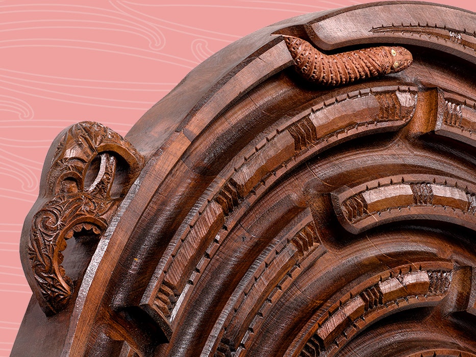 Sam Huawaho, Whaka-iro. Te Papa (ME024863) A carved wooden spiral with Māori designs on a dusky pink background.