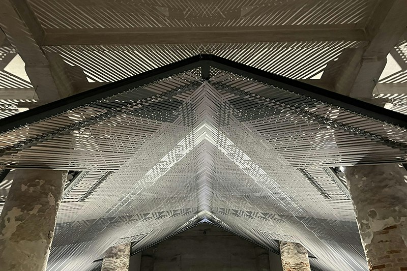 A close-up photo of the large-scale weaving installation in the Venice gallery.