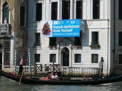 Photo by Charlotte Huddleston. Te Papa A gondola in Venice going in front of a building advertising Francis Upritchard's art installation.