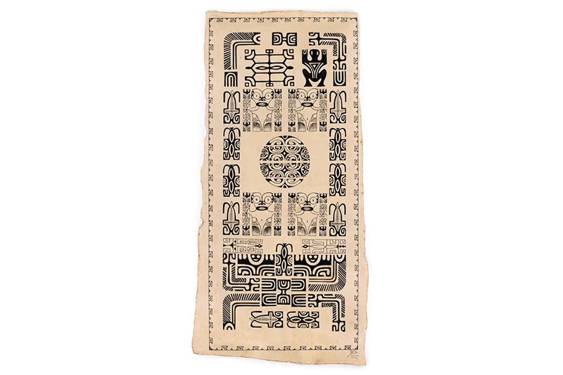 A long piece of tapa with intricate patterns painted on it.
