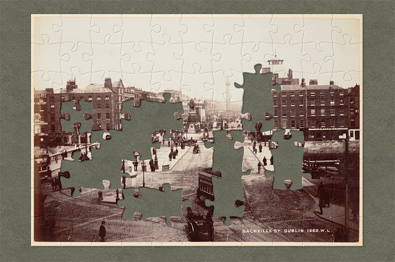 Sepia image of a  city in the 1880s with jigsaw pieces cut out.