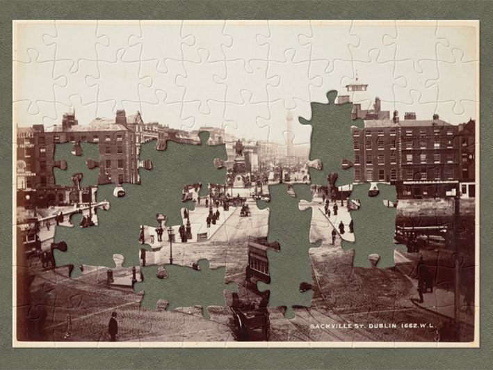 Sackville Street, Dublin, 1880s, Northern Ireland, by William Lawrence Studio. Purchased 1991. Te Papa (O.007139) Sepia image of a city in the 1880s with jigsaw pieces cut out.