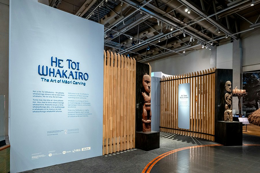 An entrance into a gallery exhibition about Māori carving.