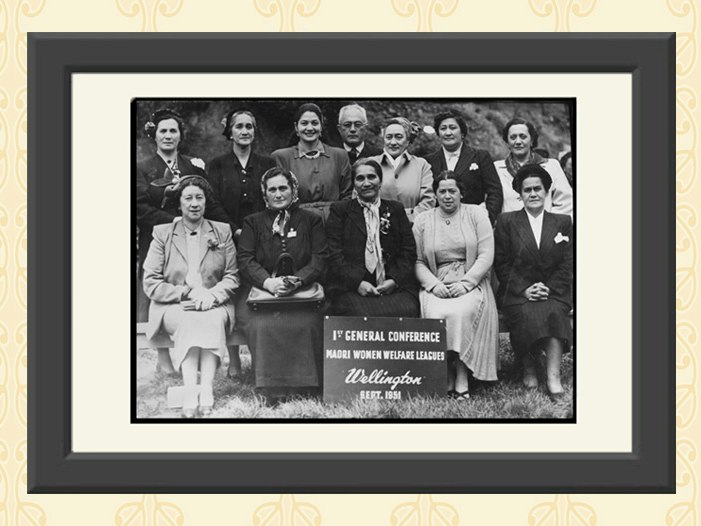 Māori Women's Welfare League Conference. Māori Women's Welfare League: Photograph albums recording conferences and other League events. Ref: 1/2-173500-F. Alexander Turnbull Library, Wellington, New Zealand. /records/44819017 A black and white framed photo with women gathered for a formal photograph with some sitting and some standing behind them.
