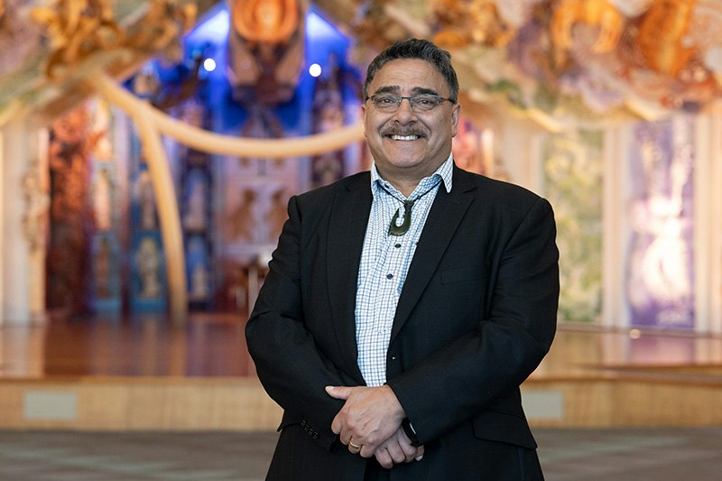 A man are standing in the contemporary marae at Te Papa